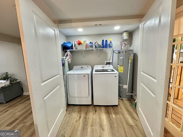 2165 S River Rd, Franklin, GA 30217 - laundry area featuring water heater, light wood finished floors, washing machine and dryer, and recessed lighting