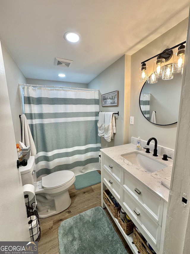 2165 S River Rd, Franklin, GA 30217 - bathroom with toilet, wood finished floors, vanity, a shower with shower curtain, and recessed lighting