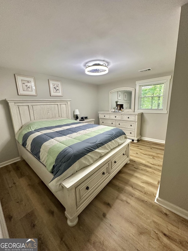 2165 S River Rd, Franklin, GA 30217 - bedroom with light wood-type flooring and baseboards