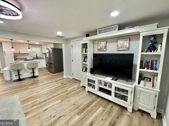 2165 S River Rd, Franklin, GA 30217 - living area featuring light wood finished floors, recessed lighting, and baseboards