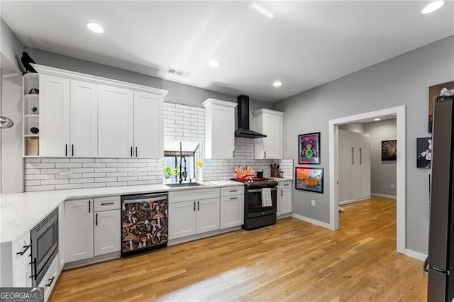 611 Pickett St SE, Atlanta, GA 30316 - kitchen with appliances with stainless steel finishes, wall chimney exhaust hood, open shelves, decorative backsplash, and white cabinetry