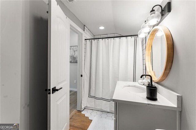 611 Pickett St SE, Atlanta, GA 30316 - bathroom featuring vanity, wood finished floors, recessed lighting, and a shower with shower curtain