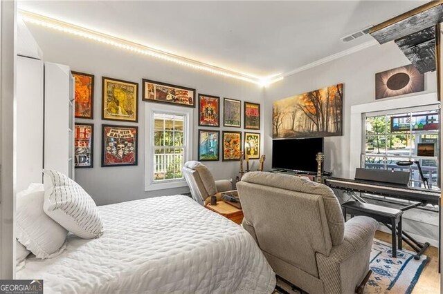 611 Pickett St SE, Atlanta, GA 30316 - bedroom with crown molding and wood finished floors