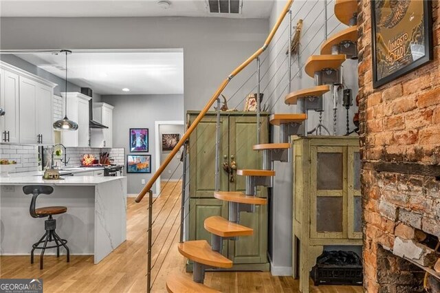 611 Pickett St SE, Atlanta, GA 30316 - stairway featuring wood finished floors and recessed lighting