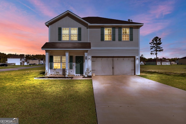 247 Morgan Field Blvd, Ludowici, GA 31316 - traditional home with a garage, driveway, a front lawn, and a porch