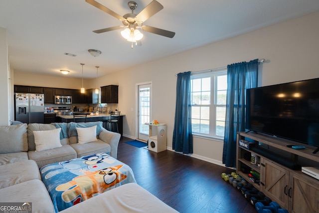 247 Morgan Field Blvd, Ludowici, GA 31316 - living area with dark wood-style flooring, baseboards, and ceiling fan