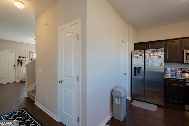 247 Morgan Field Blvd, Ludowici, GA 31316 - kitchen featuring appliances with stainless steel finishes, dark wood-style flooring, dark brown cabinetry, and baseboards