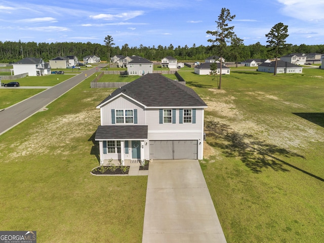 247 Morgan Field Blvd, Ludowici, GA 31316 - traditional-style home featuring an attached garage, a residential view, and driveway