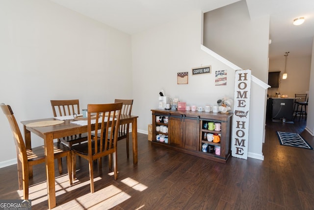 247 Morgan Field Blvd, Ludowici, GA 31316 - dining space featuring dark wood-style flooring, baseboards, and a dry bar