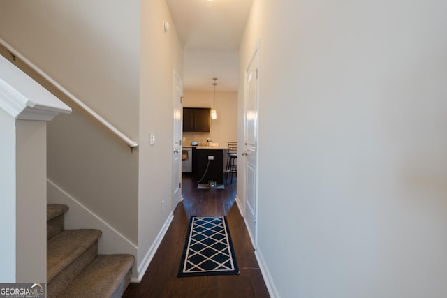 247 Morgan Field Blvd, Ludowici, GA 31316 - corridor with dark wood-style flooring, stairs, and baseboards