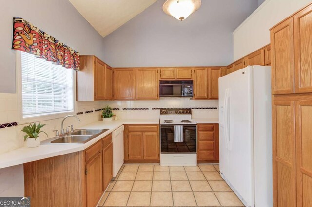 3585 Berkeley Park Ct, Duluth, GA 30096 - kitchen with white appliances, a sink, vaulted ceiling, light countertops, and tasteful backsplash