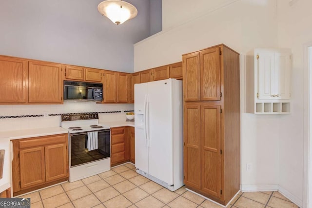 3585 Berkeley Park Ct, Duluth, GA 30096 - kitchen featuring white refrigerator with ice dispenser, electric range, black microwave, high vaulted ceiling, and light tile patterned floors