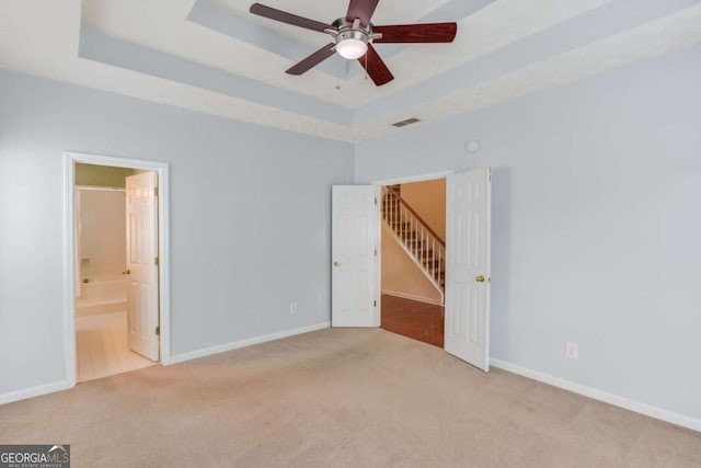 3585 Berkeley Park Ct, Duluth, GA 30096 - unfurnished bedroom with carpet floors, a raised ceiling, baseboards, and connected bathroom