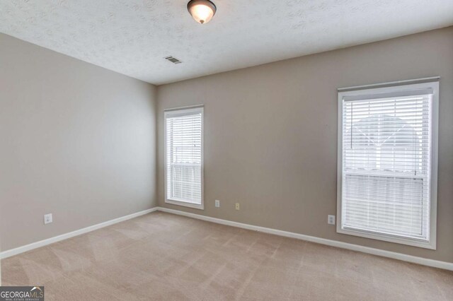 3585 Berkeley Park Ct, Duluth, GA 30096 - spare room with baseboards and light colored carpet