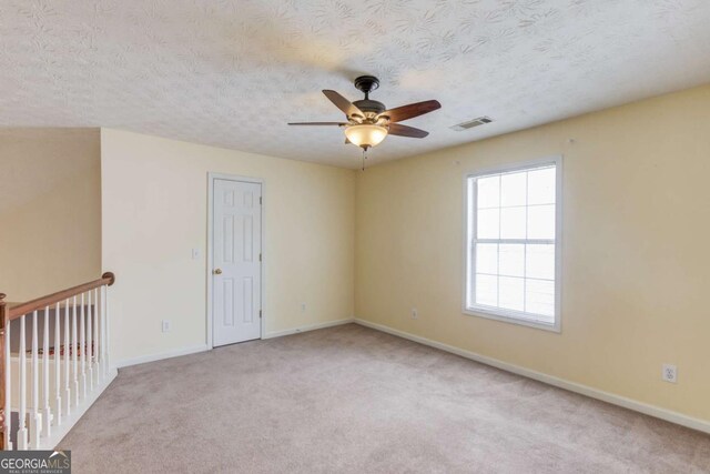 3585 Berkeley Park Ct, Duluth, GA 30096 - unfurnished room featuring ceiling fan, baseboards, carpet, and a textured ceiling