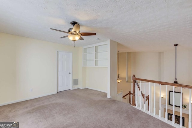 3585 Berkeley Park Ct, Duluth, GA 30096 - carpeted empty room featuring ceiling fan, a textured ceiling, and baseboards