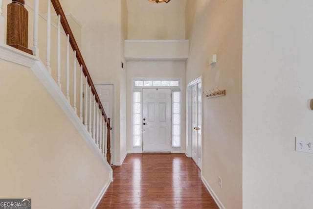 3585 Berkeley Park Ct, Duluth, GA 30096 - foyer entrance with stairway, wood-type flooring, baseboards, and a towering ceiling