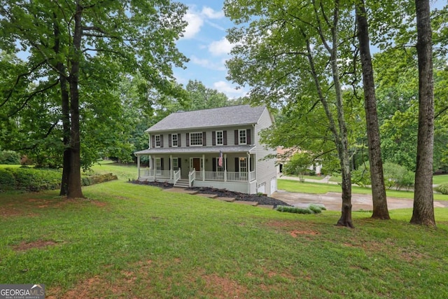 1925 Stonewyck Ct, Cumming, GA 30041 - colonial-style house with covered porch, driveway, an attached garage, and a front lawn