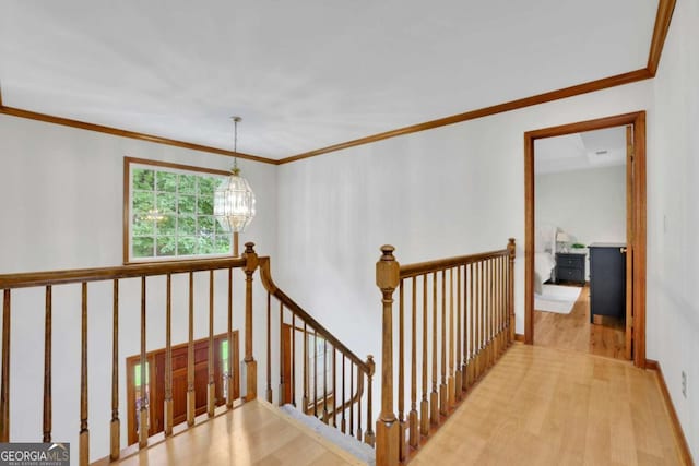 1925 Stonewyck Ct, Cumming, GA 30041 - staircase featuring a chandelier, wood finished floors, and ornamental molding