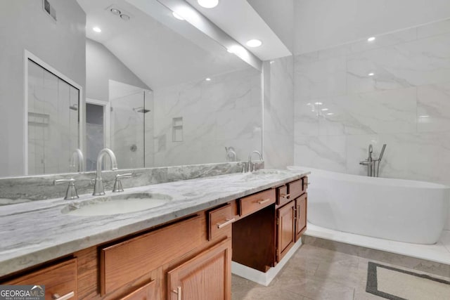 1925 Stonewyck Ct, Cumming, GA 30041 - bathroom featuring double vanity, a freestanding bath, lofted ceiling, a stall shower, and recessed lighting