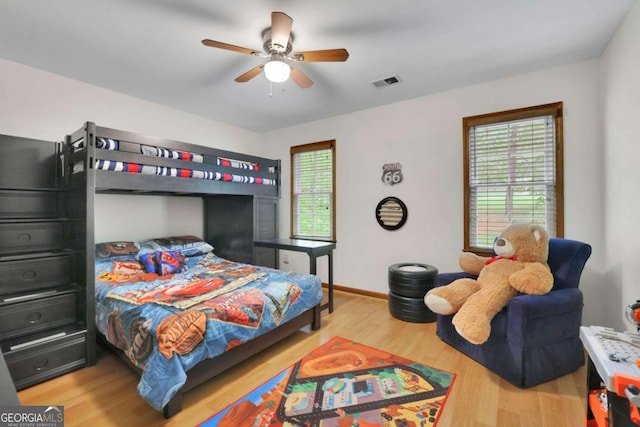 1925 Stonewyck Ct, Cumming, GA 30041 - bedroom featuring wood finished floors and a ceiling fan
