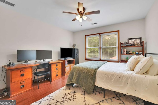 1925 Stonewyck Ct, Cumming, GA 30041 - bedroom with wood finished floors, ceiling fan, and an office area