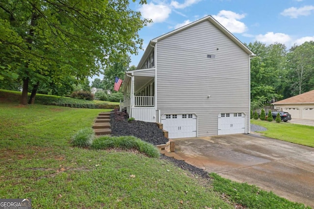 1925 Stonewyck Ct, Cumming, GA 30041 - view of home's exterior featuring a yard, a garage, and concrete driveway