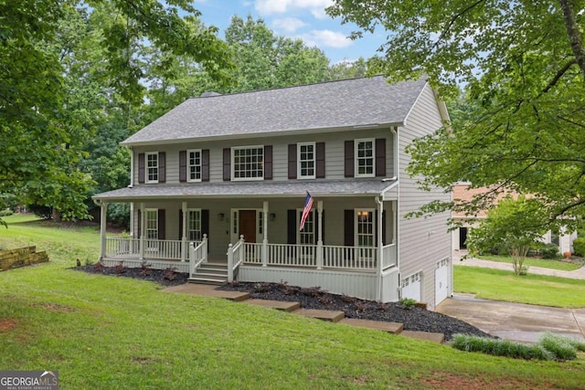 1925 Stonewyck Ct, Cumming, GA 30041 - colonial home with covered porch, concrete driveway, a front yard, and a garage