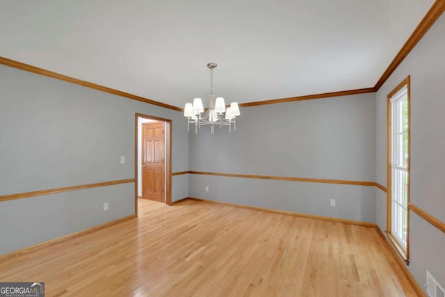 1925 Stonewyck Ct, Cumming, GA 30041 - unfurnished room with ornamental molding, a chandelier, and wood finished floors