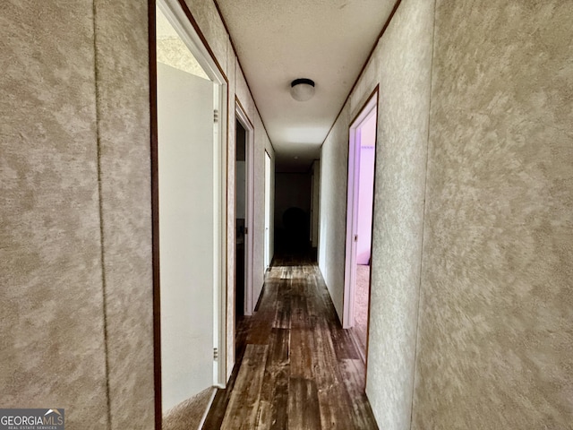 342 Wellington Dr, Byron, GA 31008 - hall with dark wood-style flooring and a textured ceiling