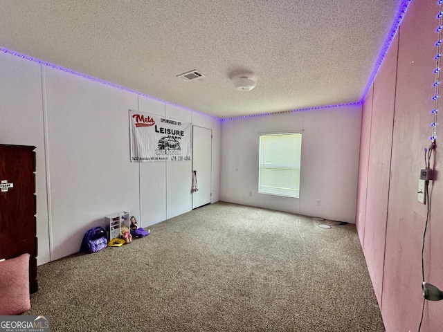 342 Wellington Dr, Byron, GA 31008 - empty room with carpet and a textured ceiling