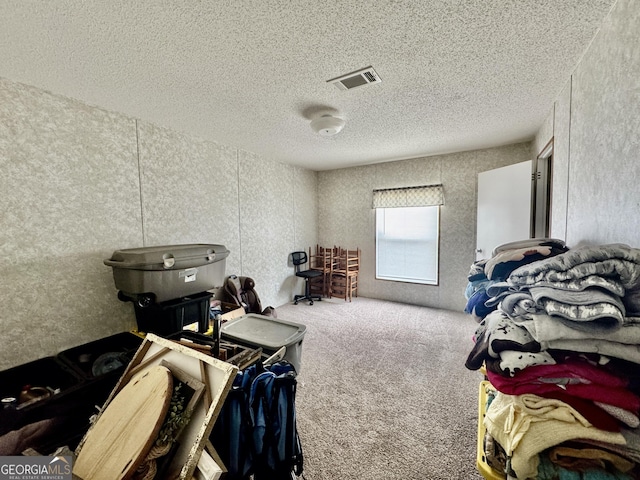 342 Wellington Dr, Byron, GA 31008 - bedroom with a textured ceiling and carpet flooring