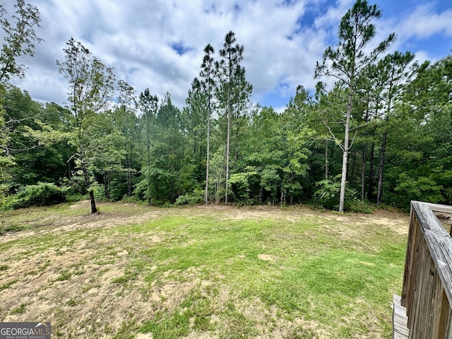 342 Wellington Dr, Byron, GA 31008 - view of grassy yard featuring a forest view