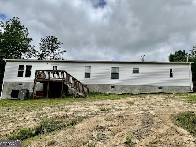 342 Wellington Dr, Byron, GA 31008 - rear view of property featuring a wooden deck, stairs, crawl space, and central AC