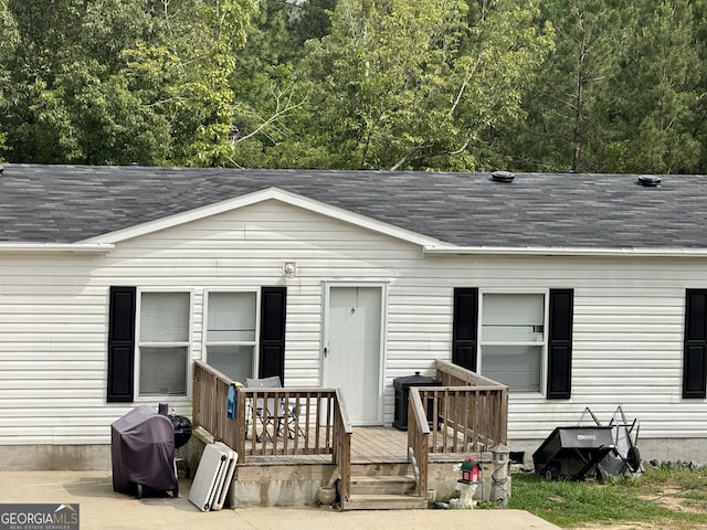 342 Wellington Dr, Byron, GA 31008 - view of front facade with a shingled roof and a deck