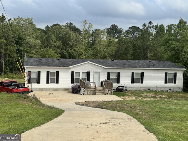 342 Wellington Dr, Byron, GA 31008 - rear view of property with a yard, crawl space, and roof with shingles