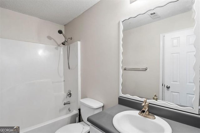 3385 Amhurst Pkwy, South Fulton, GA 30349 - full bath with vanity, tub / shower combination, a textured ceiling, and toilet