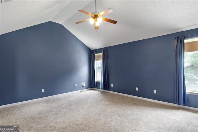 3385 Amhurst Pkwy, South Fulton, GA 30349 - spare room with ceiling fan, vaulted ceiling, carpet flooring, baseboards, and a textured ceiling