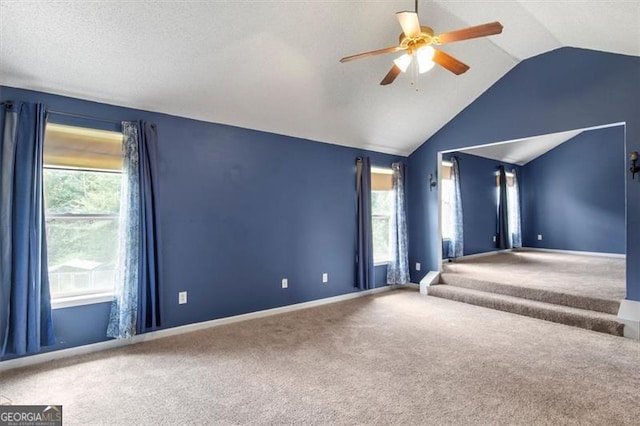 3385 Amhurst Pkwy, South Fulton, GA 30349 - carpeted spare room with a ceiling fan, vaulted ceiling, and baseboards