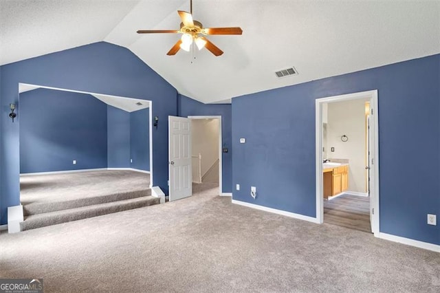 3385 Amhurst Pkwy, South Fulton, GA 30349 - unfurnished bedroom with lofted ceiling, carpet floors, baseboards, ceiling fan, and ensuite bath