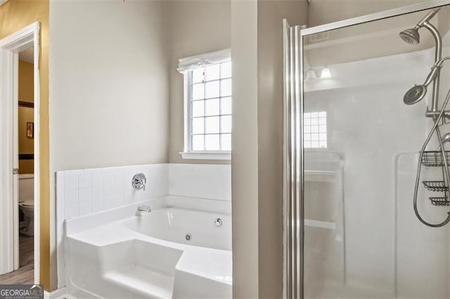 3385 Amhurst Pkwy, South Fulton, GA 30349 - bathroom featuring a stall shower, toilet, and a jetted tub