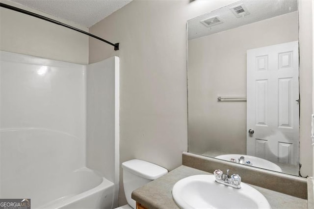3385 Amhurst Pkwy, South Fulton, GA 30349 - full bathroom featuring vanity, toilet, shower / bath combination, and a textured ceiling