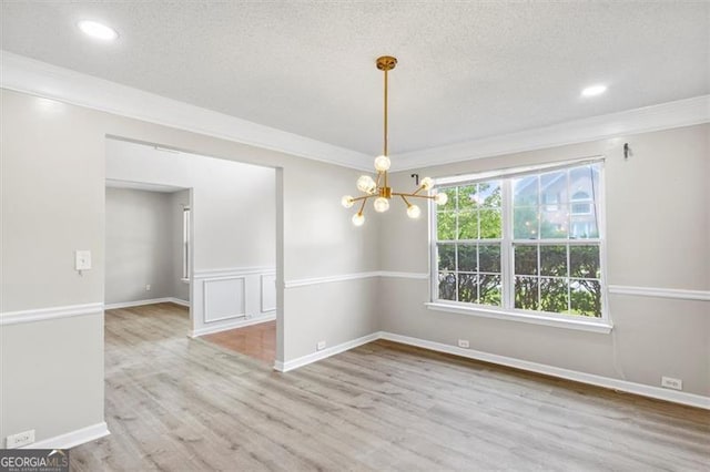 3385 Amhurst Pkwy, South Fulton, GA 30349 - unfurnished room with a chandelier, wood finished floors, ornamental molding, recessed lighting, and a textured ceiling