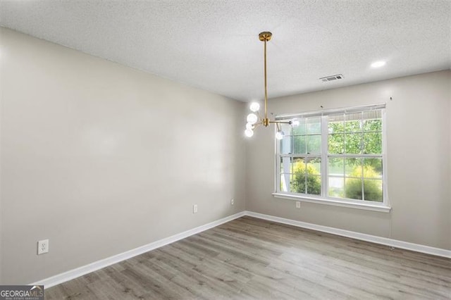 3385 Amhurst Pkwy, South Fulton, GA 30349 - empty room with wood finished floors, a textured ceiling, baseboards, and recessed lighting