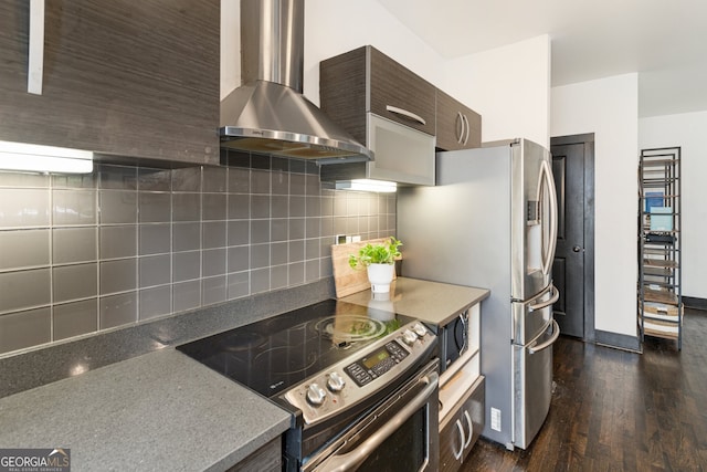1300 Dekalb Ave NE Unit 711, Atlanta, GA 30307 - kitchen with stainless steel appliances, wall chimney range hood, dark brown cabinetry, dark wood-style flooring, and backsplash