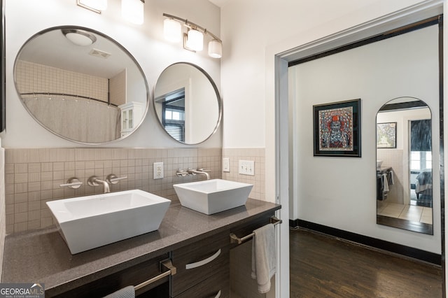 1300 Dekalb Ave NE Unit 711, Atlanta, GA 30307 - full bathroom with wood finished floors, double vanity, and plenty of natural light