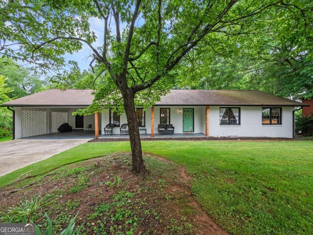 1488 Vine St NE, Gainesville, GA 30501 - ranch-style house with concrete driveway, a front lawn, covered porch, brick siding, and a carport