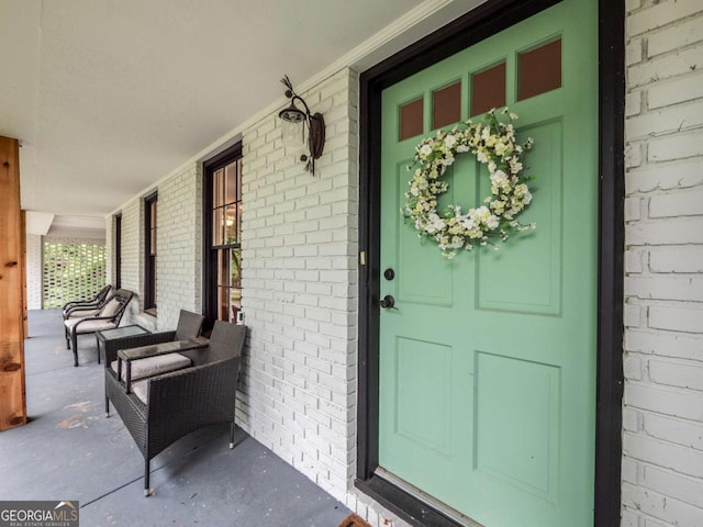 1488 Vine St NE, Gainesville, GA 30501 - property entrance featuring a porch and brick siding