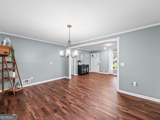 1488 Vine St NE, Gainesville, GA 30501 - unfurnished living room featuring a chandelier, wood finished floors, crown molding, and baseboards