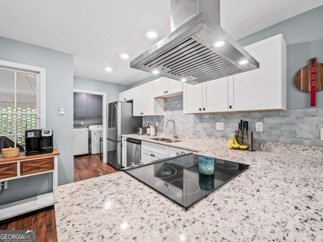 1488 Vine St NE, Gainesville, GA 30501 - kitchen featuring island exhaust hood, separate washer and dryer, a sink, dishwasher, and white cabinets